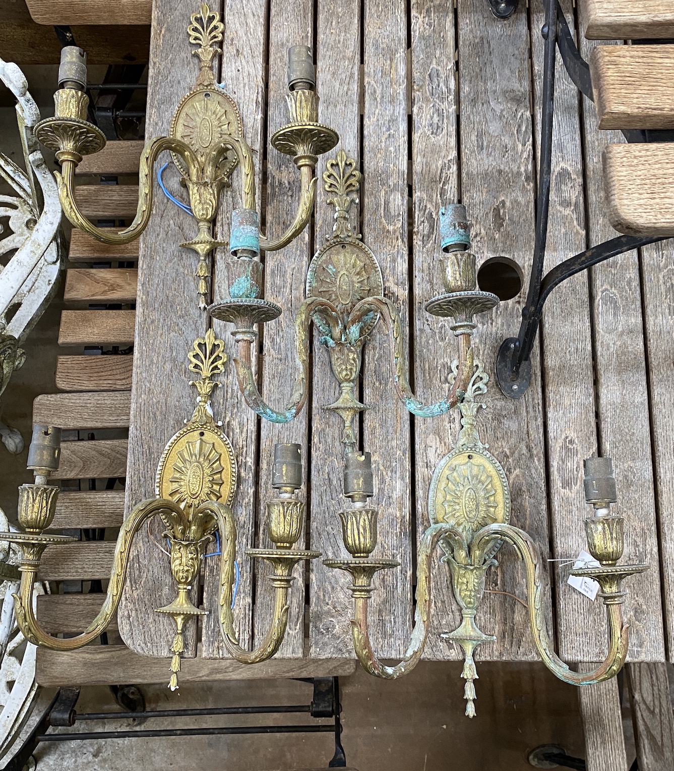 A set of four Sheraton style gilt metal two branch wall lights, height 36cm